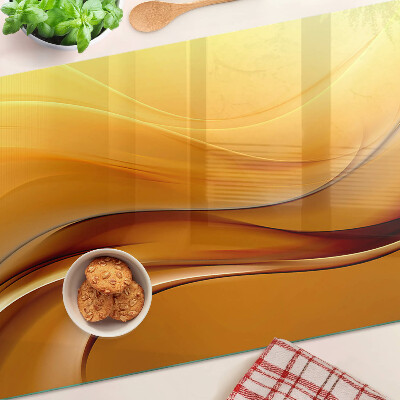 Glas schneidebrett Wellen in Goldtönen