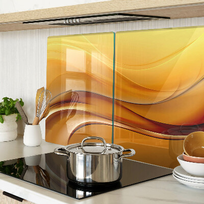 Glas Schneidebrett mit Wellen in Goldtönen