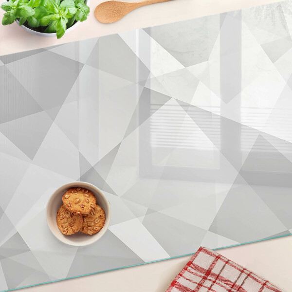 Schneidebrett mit geometrischem Motiv in Grautönen