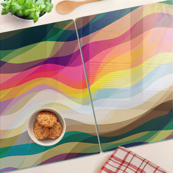 Glas-Schneidebrett mit abstrakten Farbwellen als Motiv