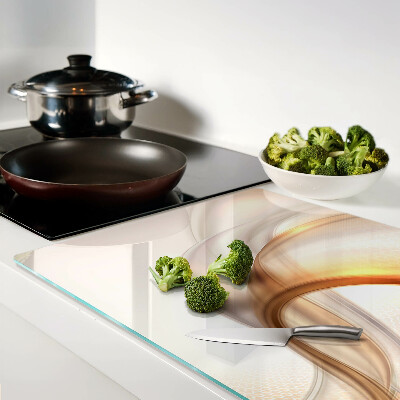 Glas Schneidebrett mit Lichtwellen in Goldtönen