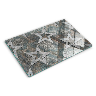 Glas schneidebrett Sterne auf strukturiertem Hintergrund