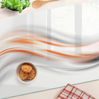 Schneidebrett mit Wellenmuster in Orange- und Grautönen