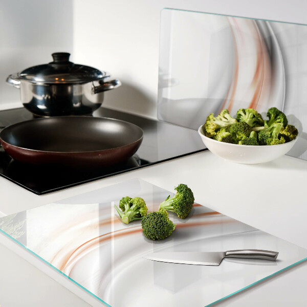 Schneidebrett mit Wellenmuster in Orange- und Grautönen