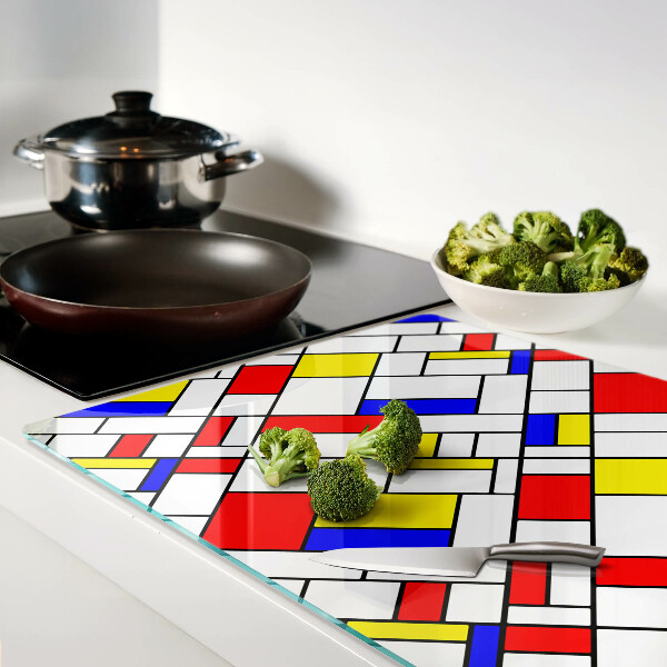 Glas-Schneidebrett mit einem geometrischen Mondrian‑Motiv