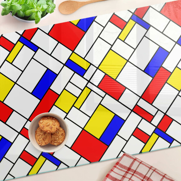 Glas-Schneidebrett mit einem geometrischen Mondrian‑Motiv