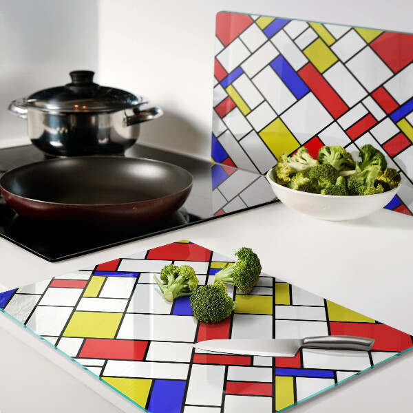 Glas-Schneidebrett mit einem geometrischen Mondrian‑Motiv