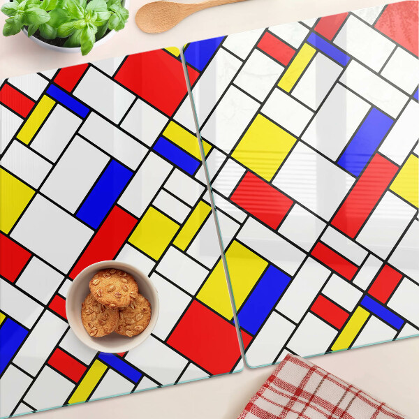 Glas-Schneidebrett mit einem geometrischen Mondrian‑Motiv