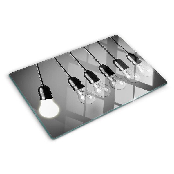 Schneidebrett mit Motiv von Glühbirnen an Kabeln