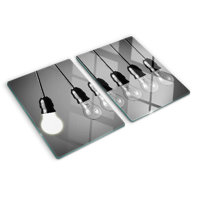 Schneidebrett mit Motiv von Glühbirnen an Kabeln