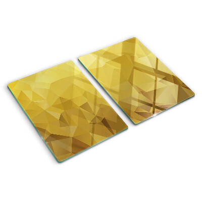 Glas-Schneidebrett mit geometrischem Muster in Goldtönen