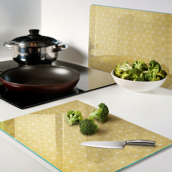 Schneidebrett Glas mit dem Motiv Blume des Lebens auf gelbem Hintergrund