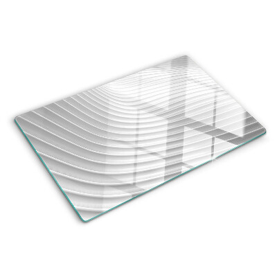 Glas-Schneidebrett mit Wellen- und Linienmotiv in Grautönen