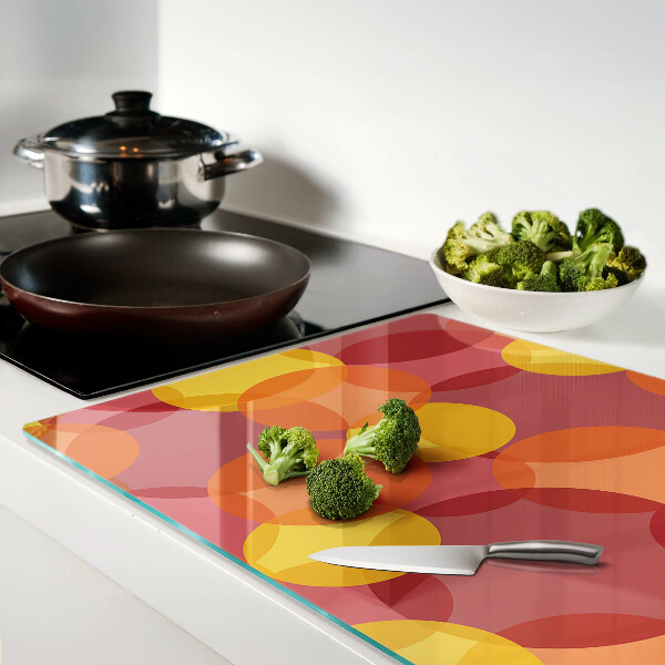 Schneidebrett Glas mit bunten Kreisen in warmen Tönen