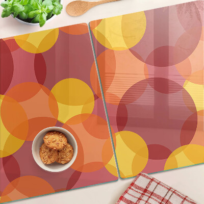 Schneidebrett Glas mit bunten Kreisen in warmen Tönen