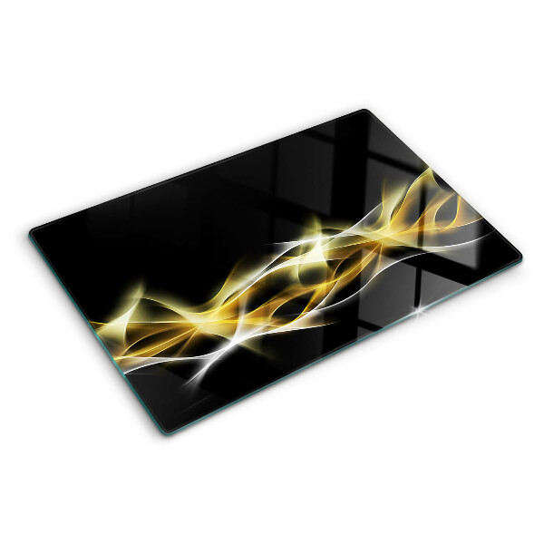 Glas-Schneidebrett mit einem goldfarbenen Lichtwellendekor