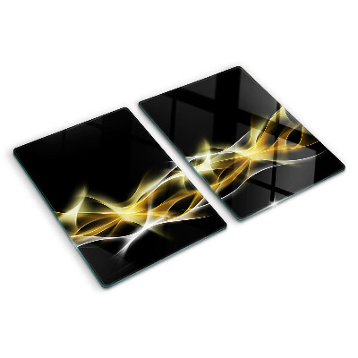 Glas-Schneidebrett mit einem goldfarbenen Lichtwellendekor