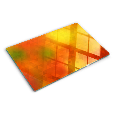 Glas-Schneidebrett mit geometrischem Muster in Orangetönen