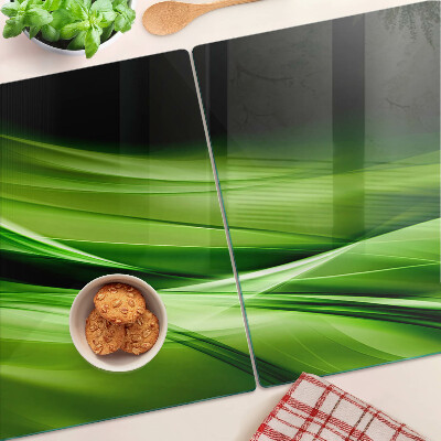 Schneidebrett mit grünem abstraktem Wellenmotiv