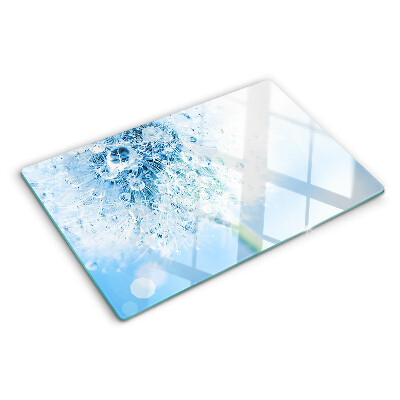 Glas-Schneidebrett mit einem Motiv aus Löwenzahnblüten und Wassertropfen