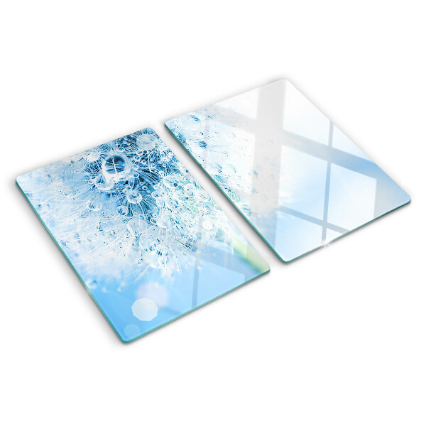 Glas schneidebrett Löwenzahnblüte mit Wassertropfen