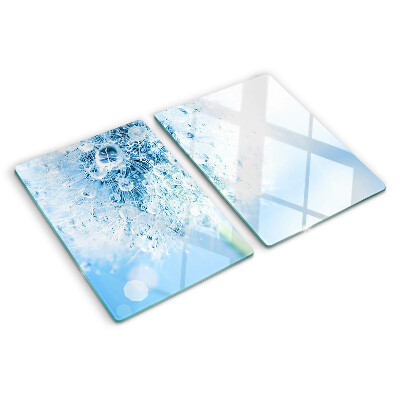 Glas schneidebrett Löwenzahnblüte mit Wassertropfen