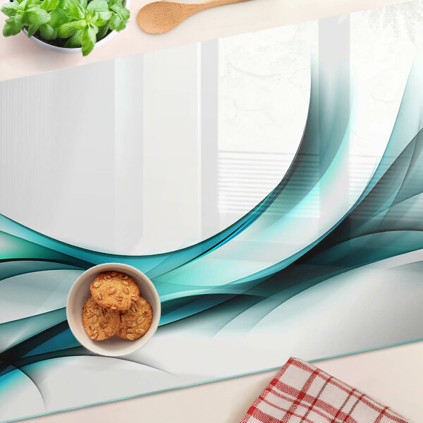 Glas-Schneidebrett mit wellenförmigem Muster in Blautönen