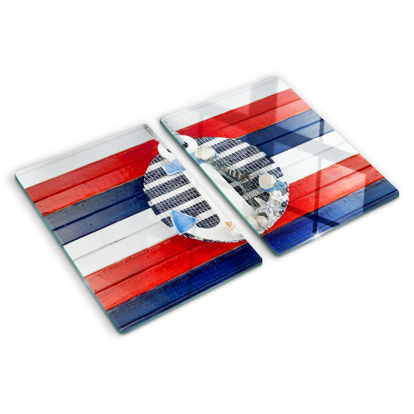 Glas Schneidebrett mit Anker-Motiv vor gestreiftem Hintergrund