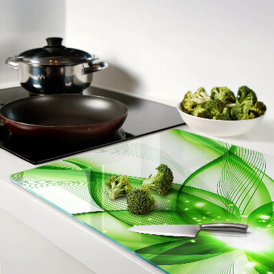 Glas-Schneidebrett mit grünem abstraktem Wellenmotiv