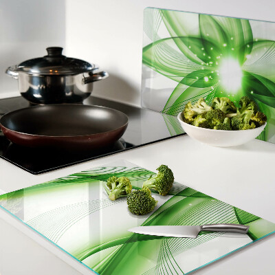 Glas-Schneidebrett mit grünem abstraktem Wellenmotiv