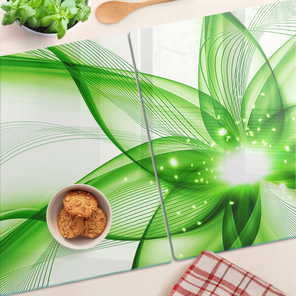 Glas-Schneidebrett mit grünem abstraktem Wellenmotiv