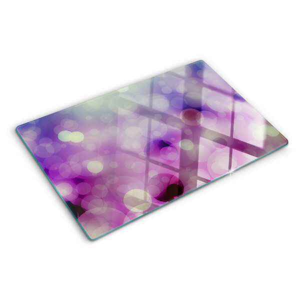 Glas-Schneidebrett mit Bokeh-Motiv in Lila- und Rosatönen