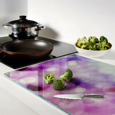 Glas-Schneidebrett mit Bokeh-Motiv in Lila- und Rosatönen