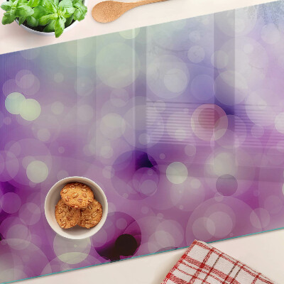 Glas schneidebrett Bokeh in Lila- und Rosatönen