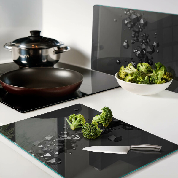 Schneidebrett glas Schwarze Kristalle im Hintergrund