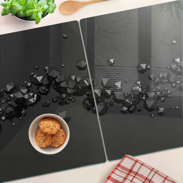 Schneidebrett glas Schwarze Kristalle im Hintergrund