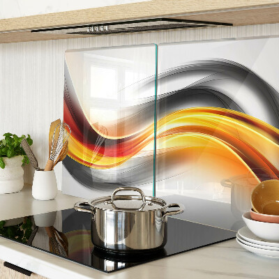Glas-Schneidebrett mit Wellenmotiv in Orange und Schwarz