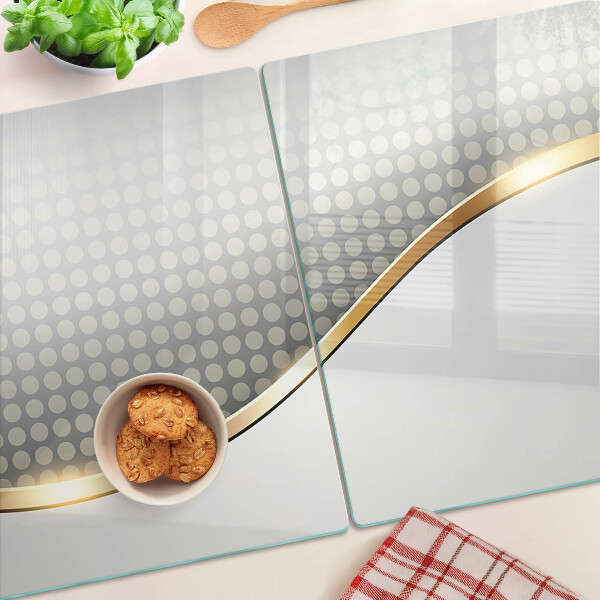 Schneidebrett glas Eine goldene Welle auf einem Hintergrund aus Punkten