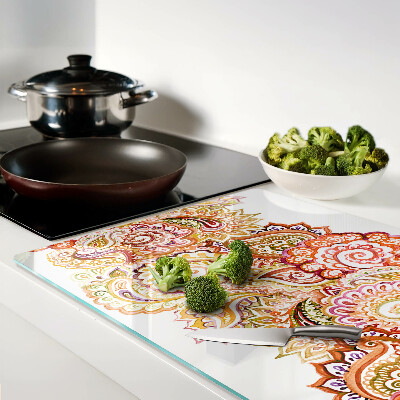 Glas-Schneidebrett mit Paisley-Muster in Rot- und Goldtönen