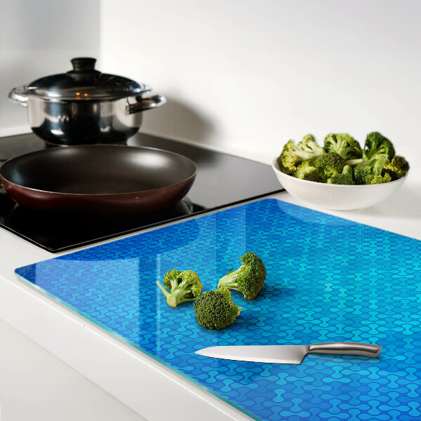 Glas schneidebrett mit wellenförmigem Muster in Blautönen