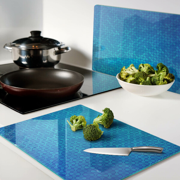 Glas schneidebrett Ein wellenförmiges Muster in Blautönen