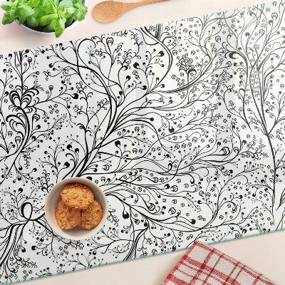 Glas schneidebrett Ein Pflanzenmuster mit zarten Zweigen