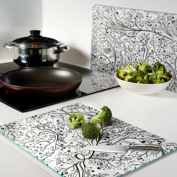 Glas Schneidebrett mit Pflanzenmuster und zarten Zweigen