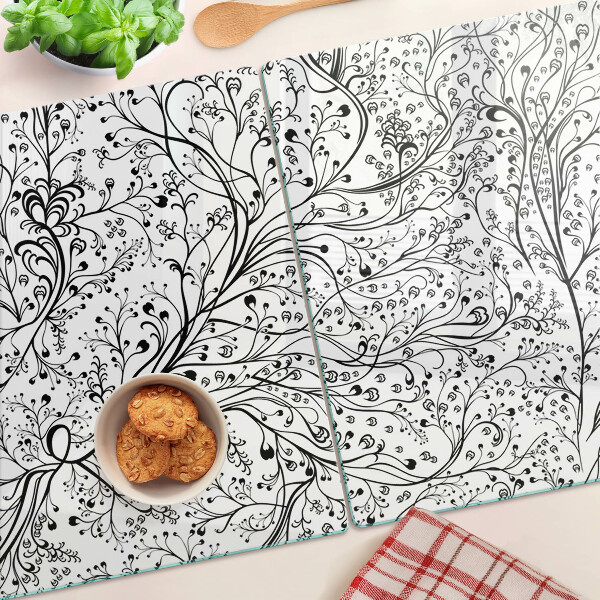 Glas schneidebrett Ein Pflanzenmuster mit zarten Zweigen