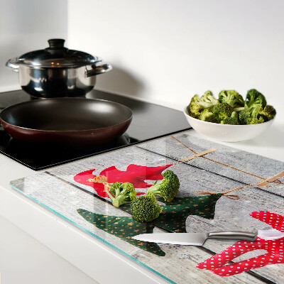 Schneidebrett mit Weihnachtsdekorationen auf Holzoptik