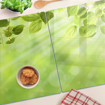 Schneidebrett Glas mit grünem Blattmotiv im Lichtdesign