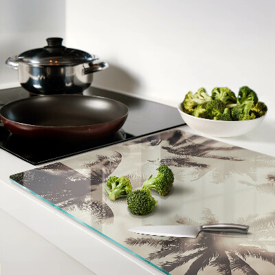 Schneidebrett mit Palmenmotiv auf einfarbigem Hintergrund