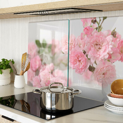 Glas schneidebrett mit rosa Blumen in einer Vase