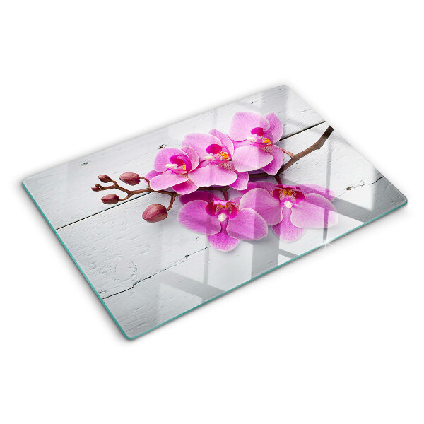 Schneidebrett Glas mit Orchideenmotiv auf weißem Hintergrund