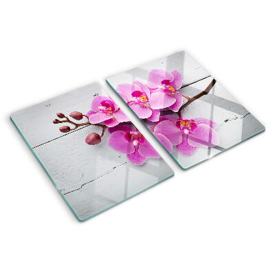 Schneidebrett Glas mit Orchideenmotiv auf weißem Hintergrund